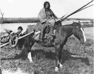 woman with travois and child